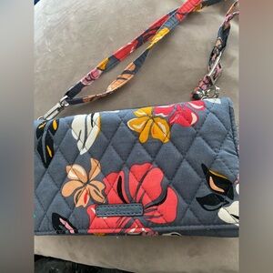 Vera Bradley Clutch/wristlet wallet with crossbody strap and wrist strap.